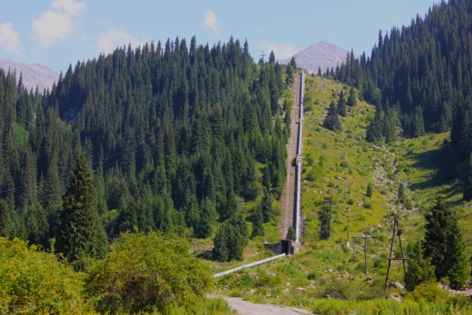 The historic water intake pipeline running down the mountainside near Big Almaty Lake