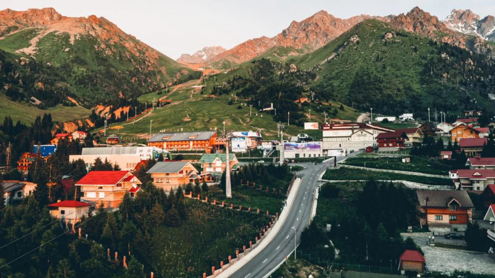 Aerial view of the Shymbulak resort village at golden hour